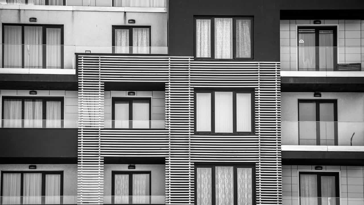 No provision in PGBP which deems rental income from unsold flats held as stock as Business income: ITAT